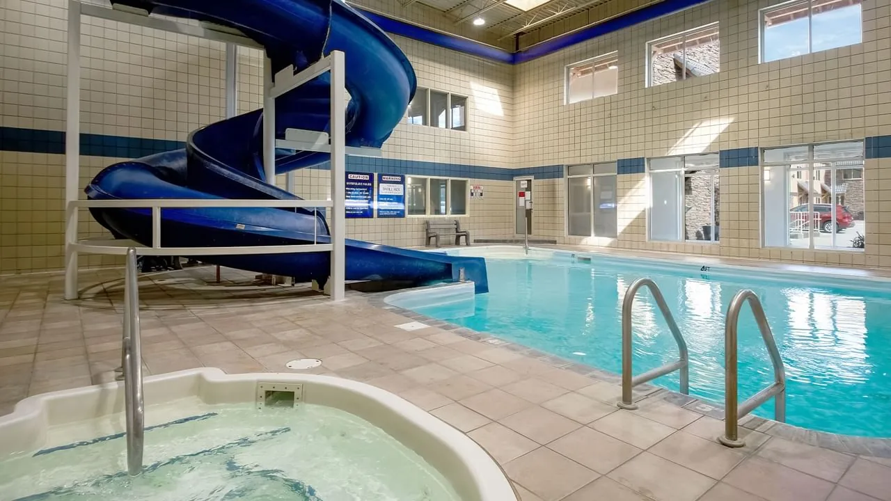 Indoor hotel pool, waterslide and hot tub